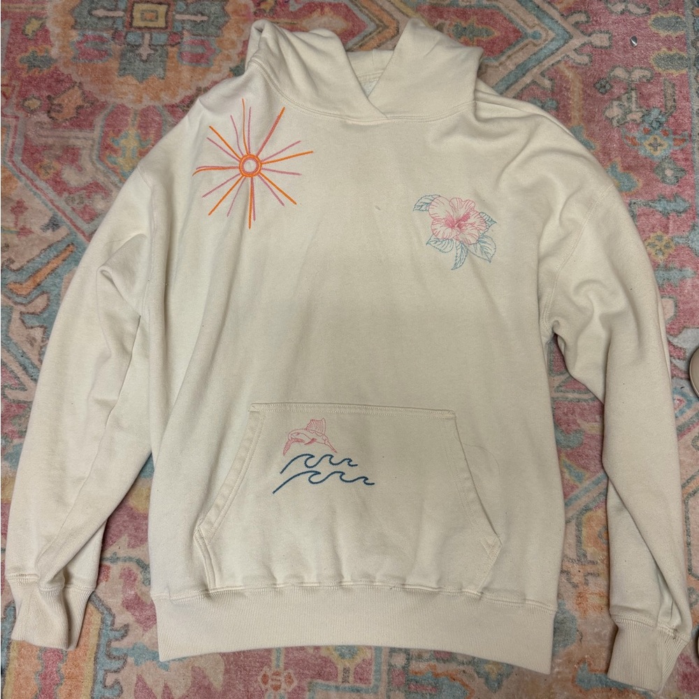 Hollister Cream Hoodie with Floral and Sunburst Design